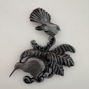 Kiwi and Fantail on Fern